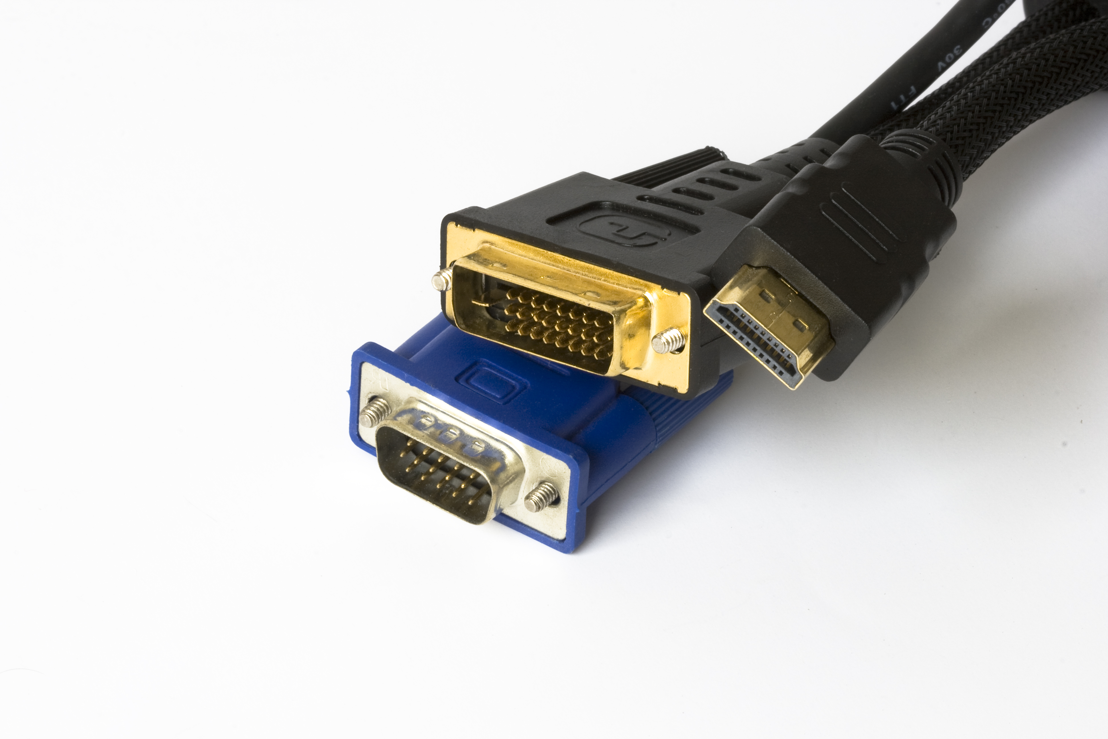 Three generations of video connectors: VGA, DVI and HDMI on a white background