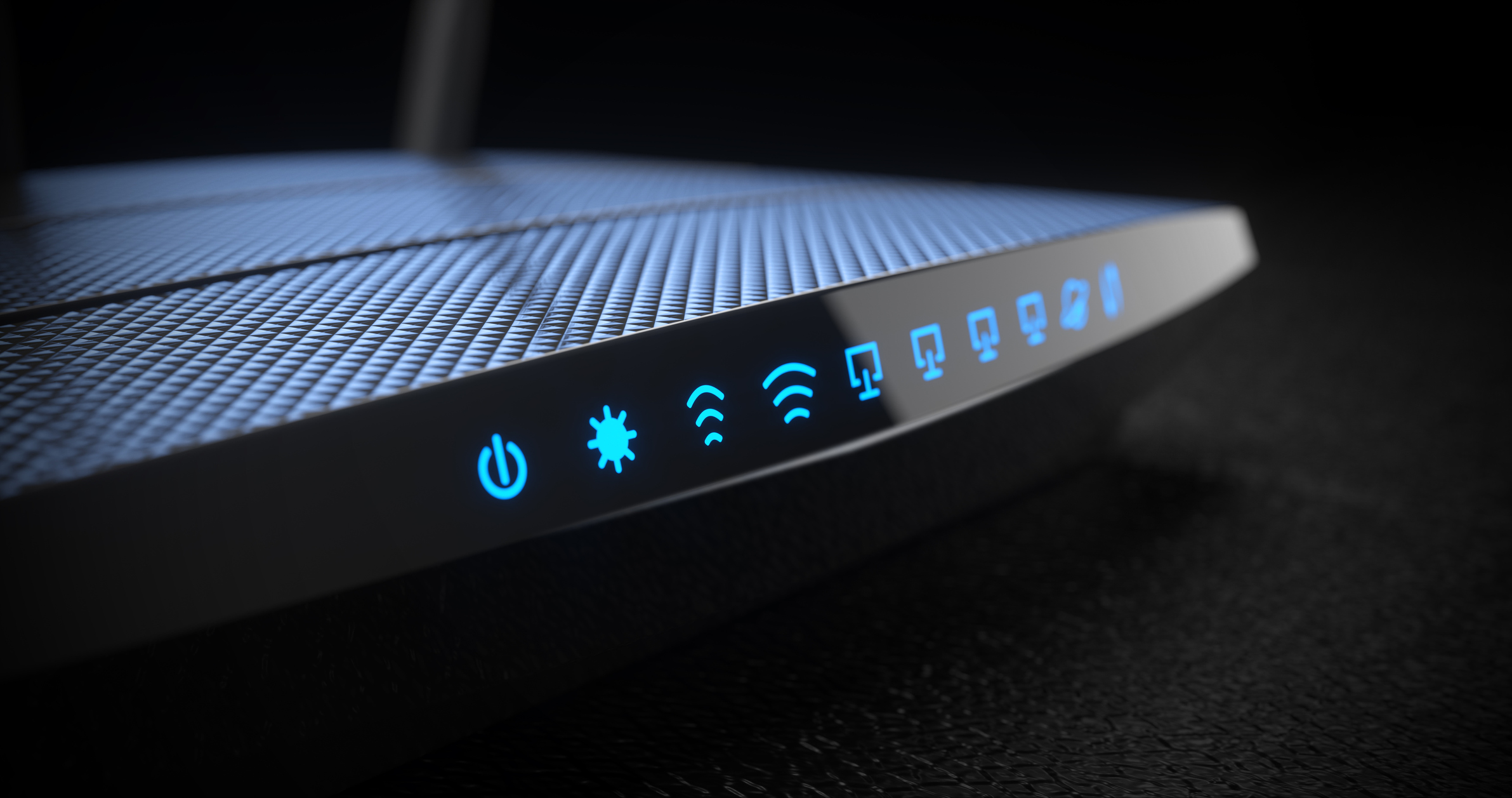 Black Wi-Fi wireless internet router on dark background