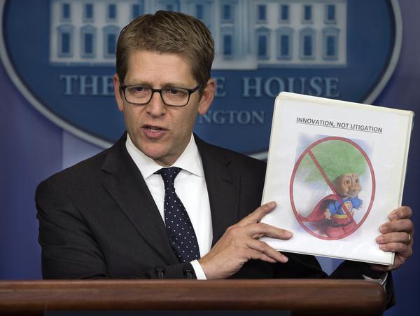 White House Press Secretary Jay Carney, speaking to reporters Tuesday, discusses steps to target so-called patent trolls. (Evan Vucci, AP)